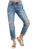 Model poses wearing blue cuffed hem ripped boyfriend jeans
