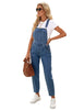 Model poses wearing blue cuffed denim bib jeans overalls