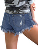 Back view of model wearing blue fringed hem distressed denim shorts