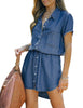 Front view of model wearing blue elastic waist curved hem button down denim shirt dress