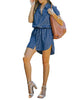 Full front view of model wearing blue elastic waist curved hem button down denim shirt dress