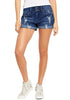 Model poses wearing blue roll-over hem double button distressed denim shorts