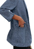 Side view of model wearing deep blue lapel collar flap pockets open-front denim blazer