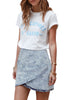 Model wearing grey acid wash tulip ruched denim mini skirt