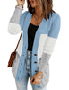 Front view of model wearing light blue colorblock front pockets button-up cable knit cardigan