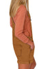 Side view of model wearing camel  rolled hem shorts denim bib overall