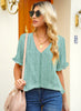 Front view of model wearing light green ruffle trim short sleeves printed V-neck button-down top