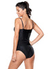 Angled back view of model in black ruched tankini set