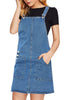 Angled shot of model wearing blue side pockets overall denim pinafore dress