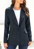 Angled shot of model wearing navy lapel front-button side-pockets blazer