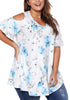 Angled shot of model wearing plus size light blue floral cold-shoulder blouse