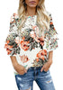 Angled shot of view of model wearing apricot trumpet sleeves keyhole-back printed blouse
