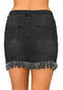 Back view of model wearing black frayed hem washed denim mini skirt