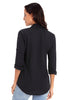 Back view of model wearing black long cuffed sleeves lapel button-up blouse
