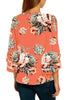 Back view of model wearing coral 34 bell mesh panel sleeves V-neckline floral top