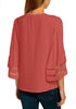 Back view of model wearing coral pink 34 bell mesh panel sleeves V-neckline loose top