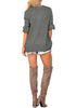Back view of model wearing dark grey lantern sleeves surplice sweater