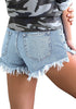 Back view of model wearing light blue frayed raw hem distressed denim shorts