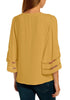 Back view of model wearing mustard yellow 34 bell mesh panel sleeves V-neckline loose top