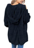 Back view of model wearing navy snuggle fleece oversized hooded cardigan