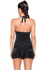 Back view of model wearing solid black flared swim skirt