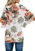 Back view of model in apricot trumpet sleeves keyhole-back printed blouse