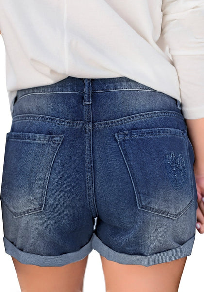 Back view of model wearing dark blue roll-over ripped washed denim shorts