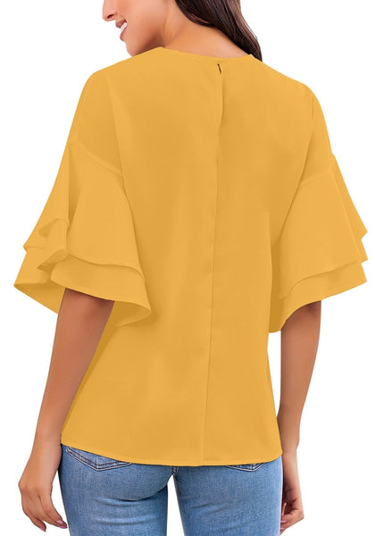 Back view of model wearing mustard yellow trumpet sleeves keyhole-back blouse