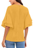 Back view of model wearing mustard yellow trumpet sleeves keyhole-back blouse