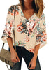 Front view of model wearing beige 34 bell mesh panel sleeves V-neckline floral top