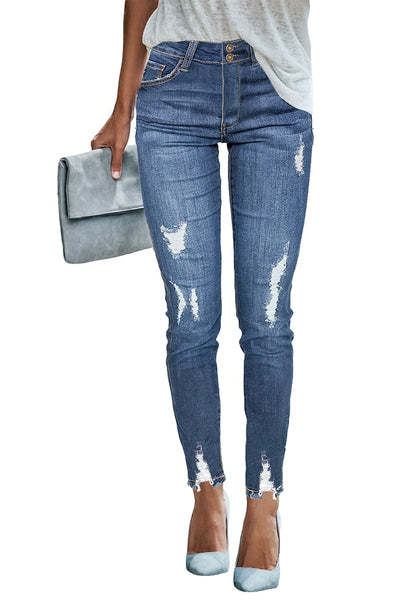 Front view of model wearing blue double button ripped skinny denim jeans