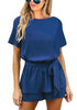 Front view of model wearing blue short sleeves keyhole-back belted romper