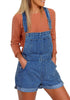 Front view of model wearing dark blue rolled hem shorts denim bib overall