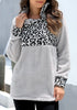 Front view of model wearing grey oblique stand collar leopard fleece pullover