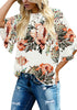 Front view of model wearing apricot trumpet sleeves keyhole-back printed blouse