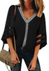 Front view of model wearing black 34 bell mesh panel sleeves V-neckline embroidered top