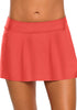 Front view of model wearing coral zipper-pocket waistband skirted bikini bottom
