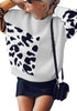 Front view of model wearing light grey animal-print colorblock batwing sleeves sweater