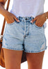Model wearing light blue mid-waist distressed washed denim shorts