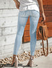 Back view of model in light blue split-hem ripped skinny denim jeans