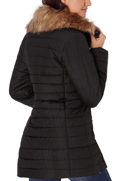 Back view of model wearing black oversized faux fur collar zip up quilted jacket