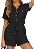 Model poses wearing black short sleeves button-down belted rompers