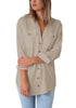 Model poses wearing khaki long cuffed sleeves lapel button-up blouse