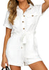 Model poses wearing white  short sleeves button-down belted romper