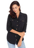 Model wearing black long cuffed sleeves lapel button-up blouse