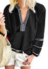 Model wearing black notched V-neckline lantern sleeves boho top