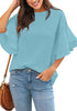Model poses wearing light blue trumpet sleeves keyhole-back blouse