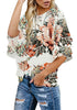 Model wearing apricot trumpet sleeves keyhole-back printed blouse