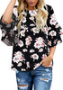 Model wearing black trumpet sleeves keyhole-back printed blouse