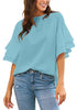 Model wearing light blue trumpet sleeves keyhole-back blouse